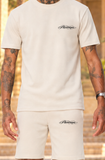 New Pharaon beige : détail du logo Pharaonique noir côté cœur et sur la poche gauche du short