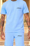 New Pharaon bleu ciel : détail du logo Pharaonique noir côté cœur et sur la poche gauche du short